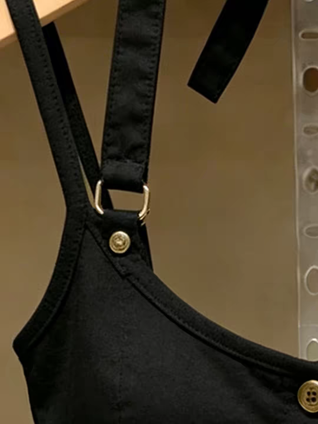 Black top adjustable strap hardware detail