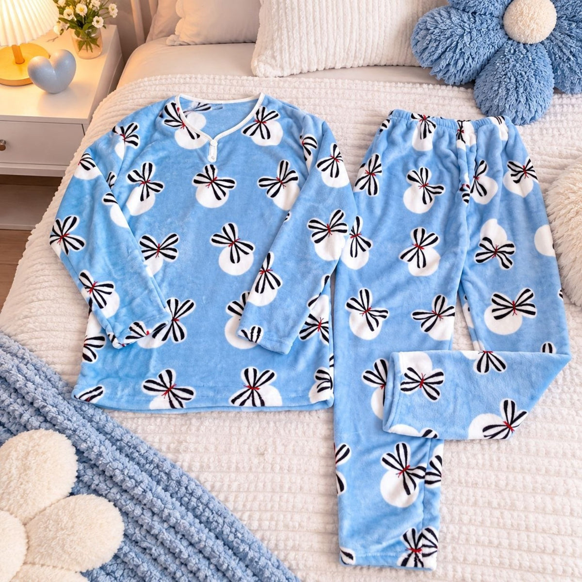 Women's blue floral warm fleece pajama set laid flat