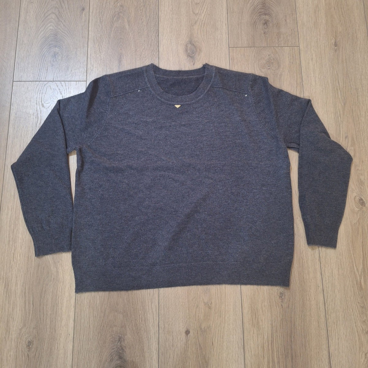 Original photo of charcoal grey knit sweater