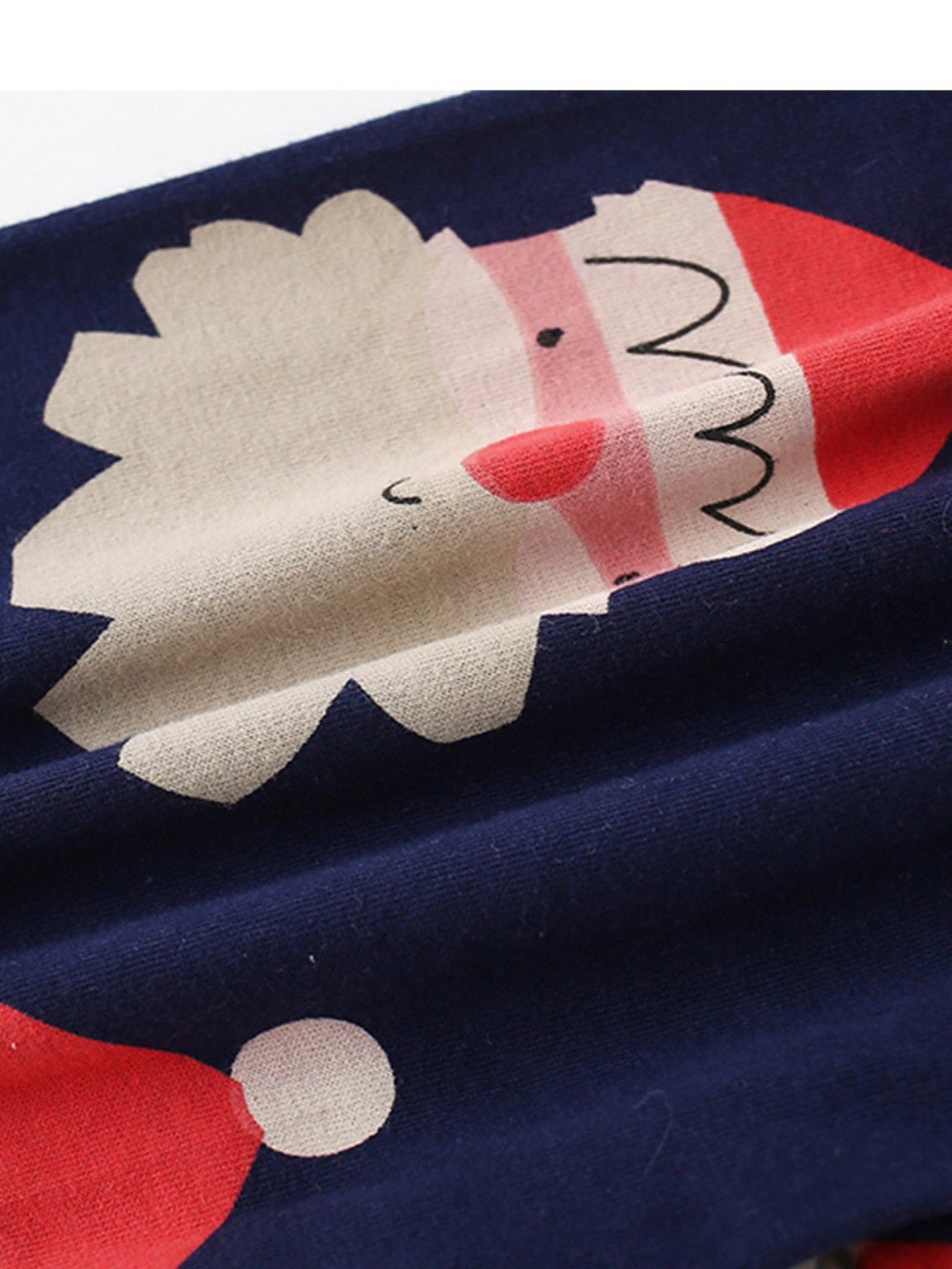 Printed Santa design and cotton fabric detail on navy pajama pants