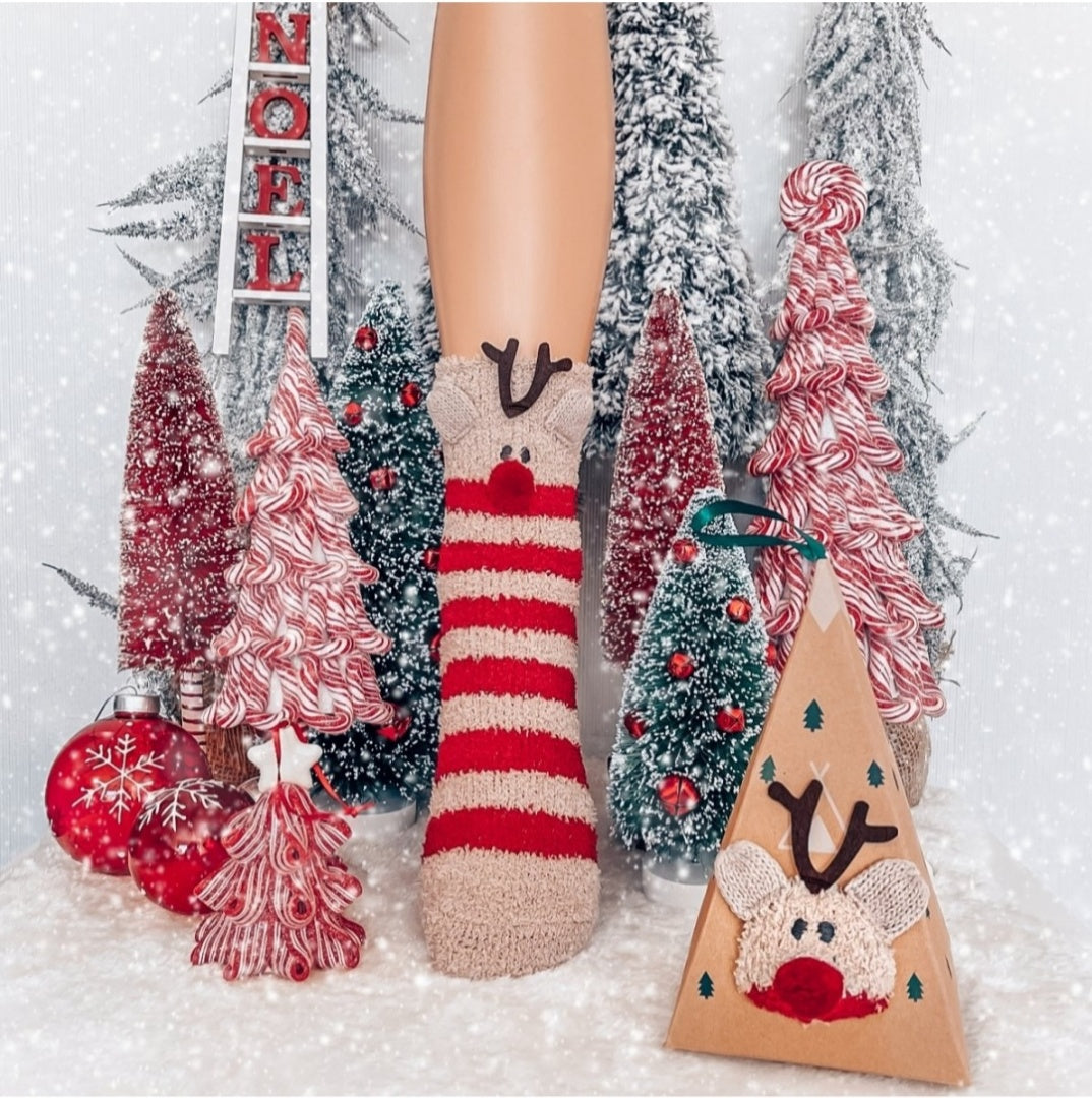 Reindeer Christmas fuzzy socks with triangle gift box in festive decor