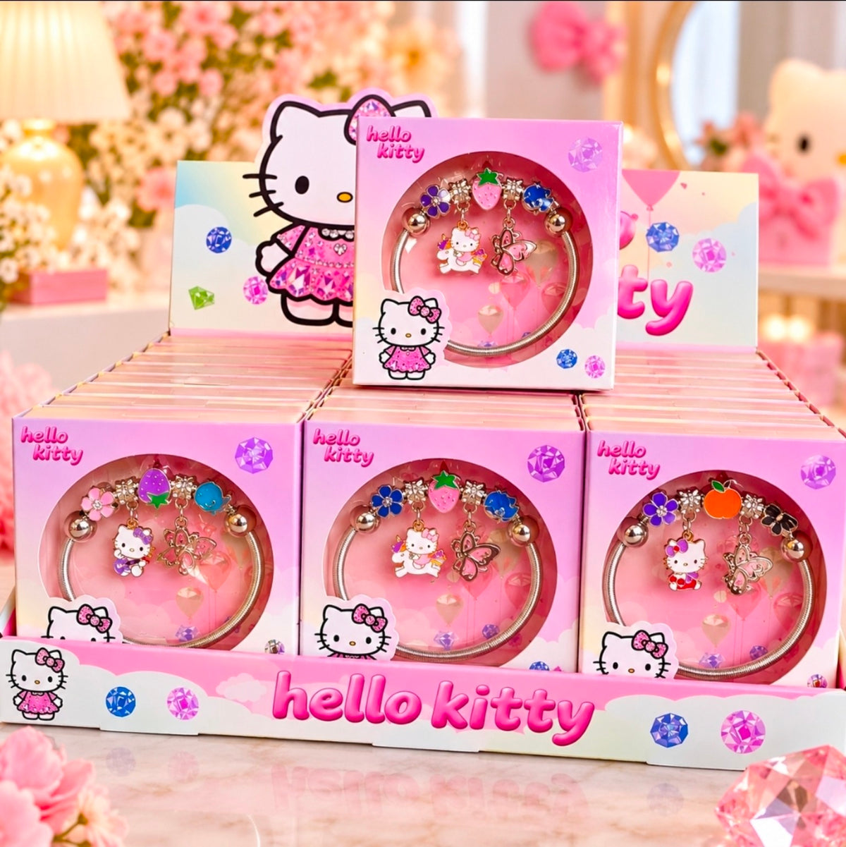 Hello Kitty charm bracelets presented in colorful pink gift boxes — three design choices