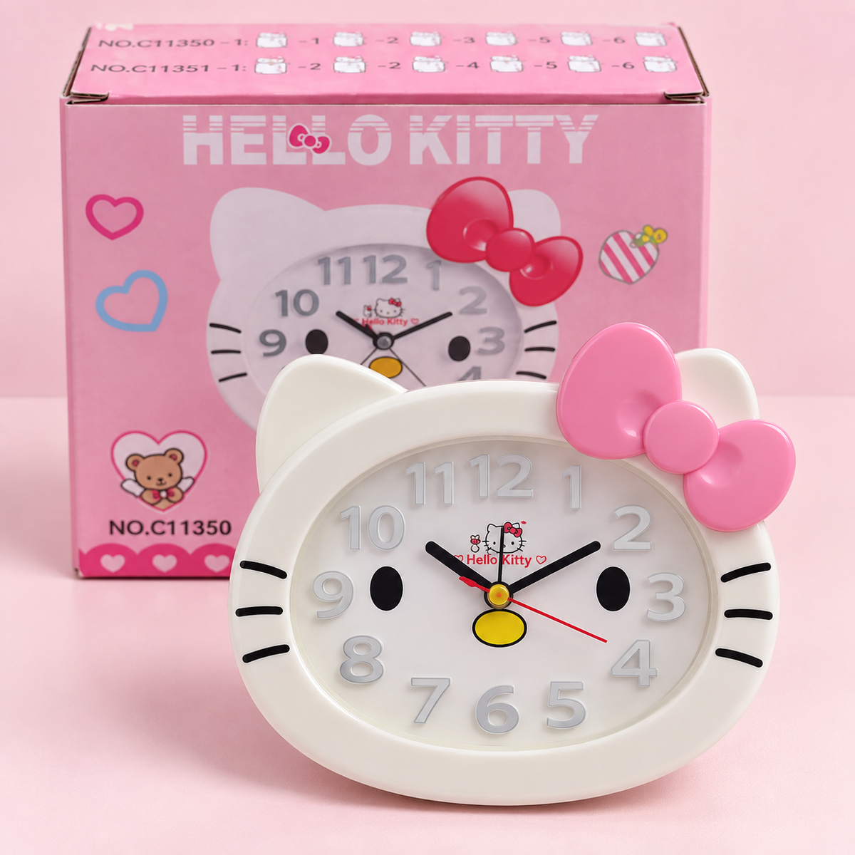 Hello Kitty face shaped clock with pink retail box
