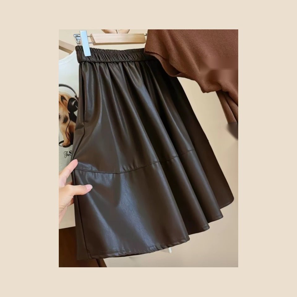 Original detail view of chocolate brown faux leather skirt with elastic waist
