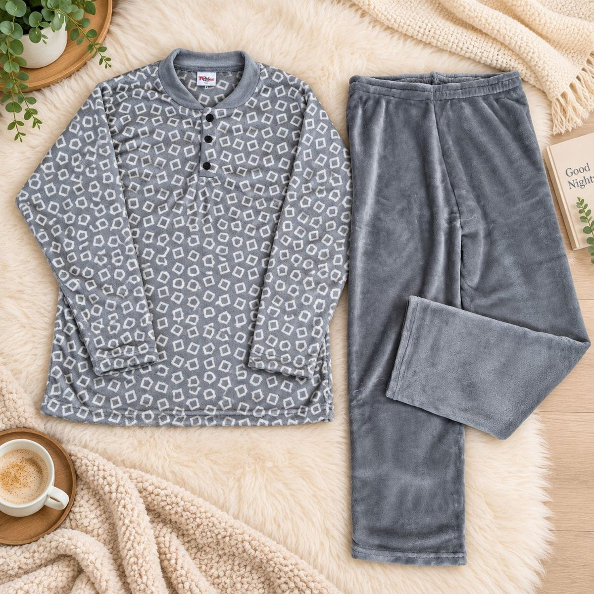 Grey men's pajama set with geometric patterned top and solid grey pants flat lay
