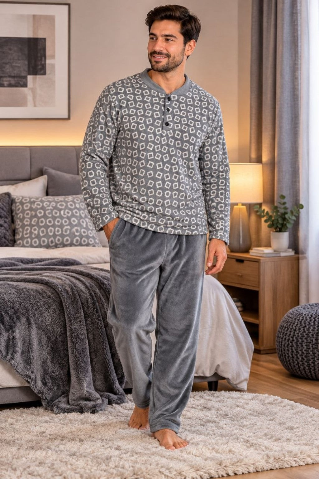 Man modeling men's grey geometric-print winter pajama set in bedroom